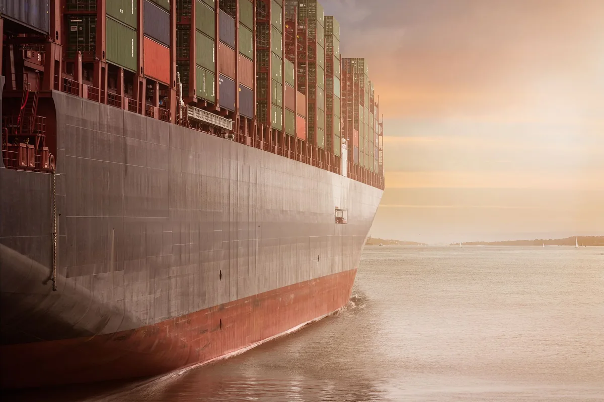 A fully laden container ship at berth, loaded for export